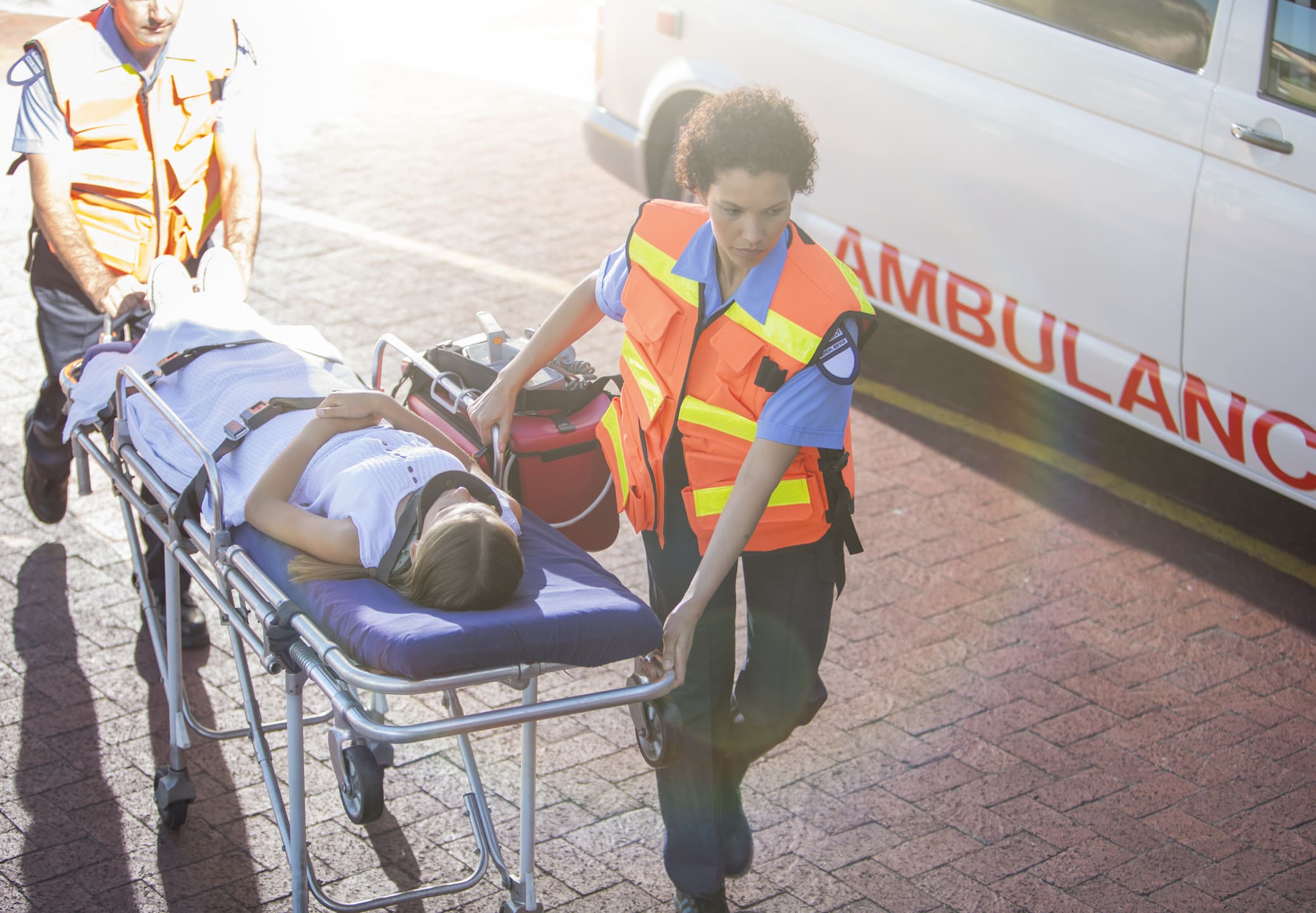 Paramedics Wheeling Severely Injured Patient To Hospital